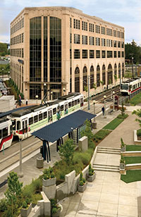 view of the office building with MAX train in the foreground